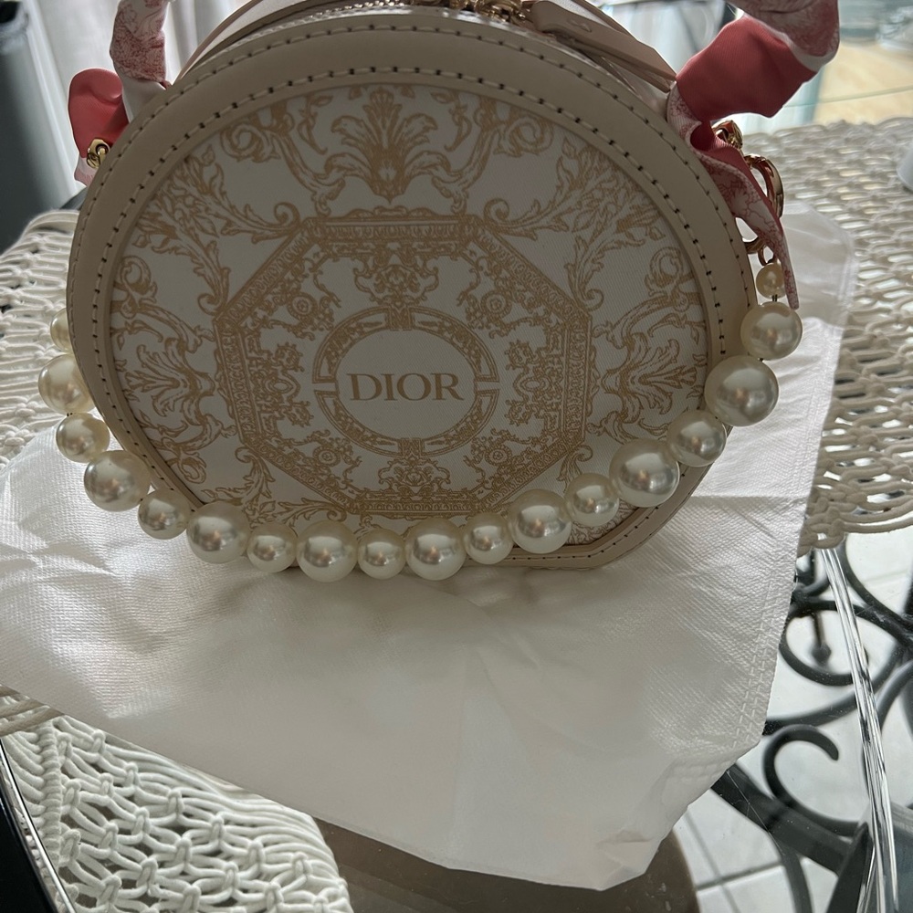 Naomi Crafted created using upcycled Dior dust bag